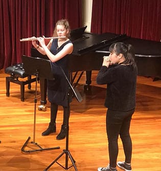Queen's High School Creative Arts Music - Queen's girls playing flute in chamber music competition
